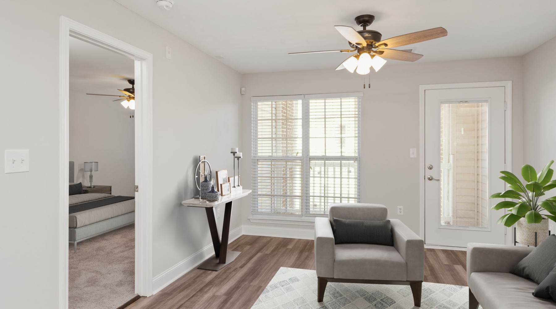 living room with seating rug plant and ceiling fan