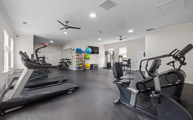a room with treadmills and exercise equipment
